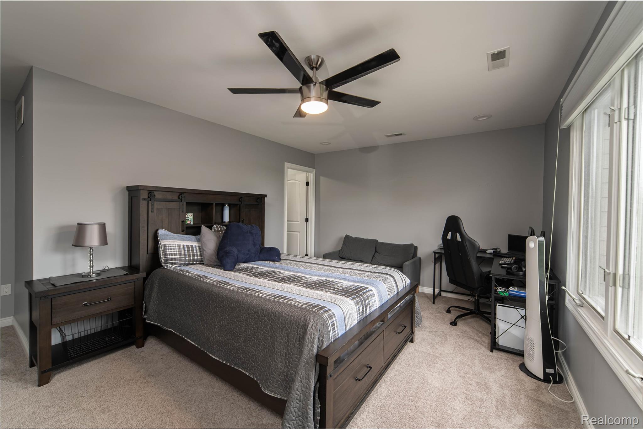 67102 Rachael Lane Washington, MI 48095 - Photo 35 of 37 Bedroom featuring an office area, light carpet, and ceiling fan