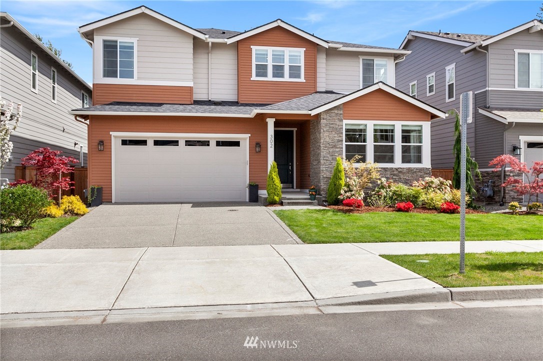 front view of a house and a yard
