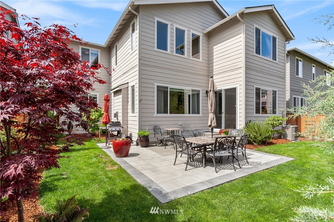 302 Graham Avenue Southeast Renton, WA 98059 - Photo 33 of 34 a view of a house with patio and a garden