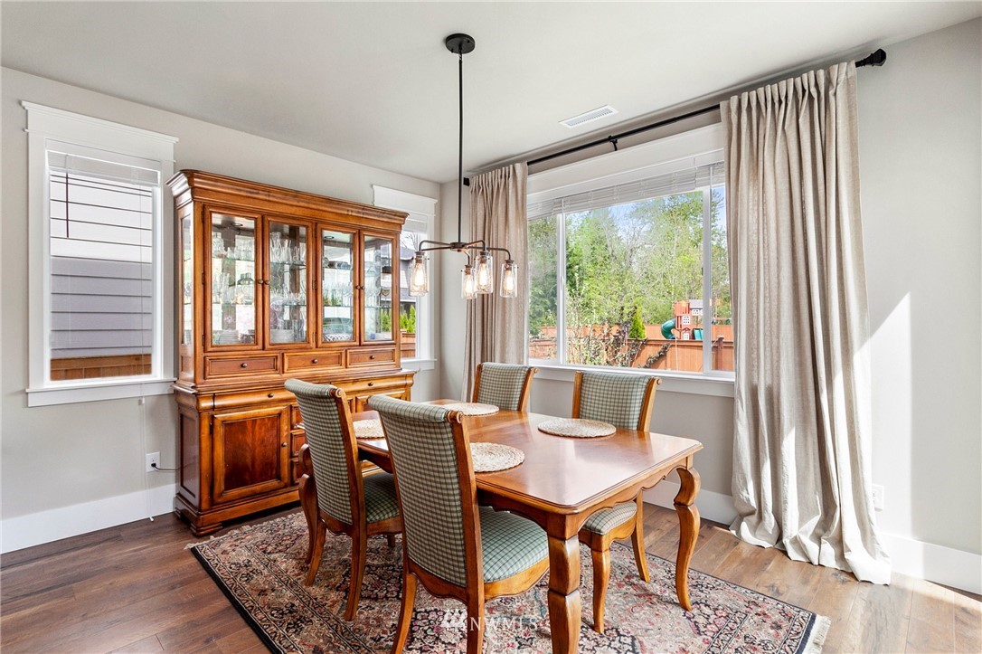 302 Graham Avenue Southeast Renton, WA 98059 - Photo 9 of 34 a view of a dining room with furniture window and outside view