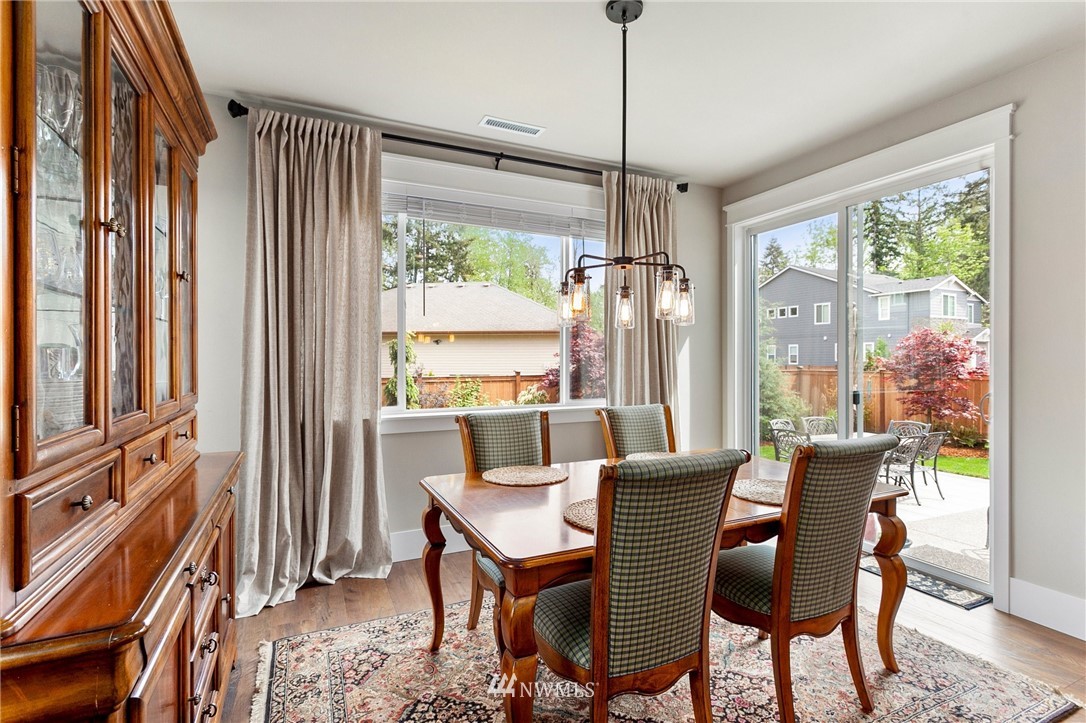 302 Graham Avenue Southeast Renton, WA 98059 - Photo 10 of 34 a view of a dining room with furniture window and outside view