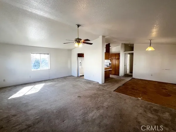 an empty room with windows and pillars in it