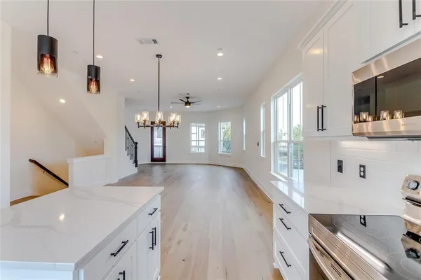 a view of a living room and a kitchen