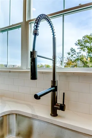 a kitchen with a sink and a window