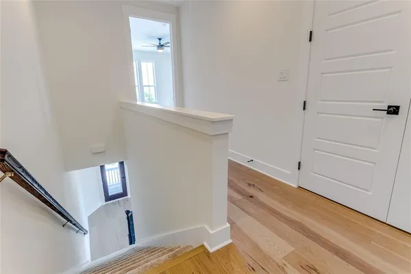 an empty room with a empty space and windows