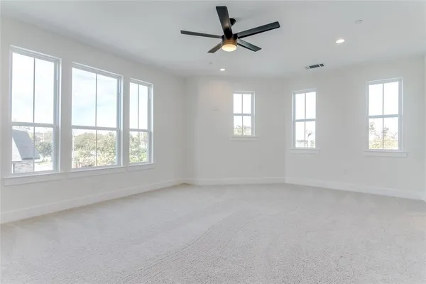 a bedroom with a large bed and a large window