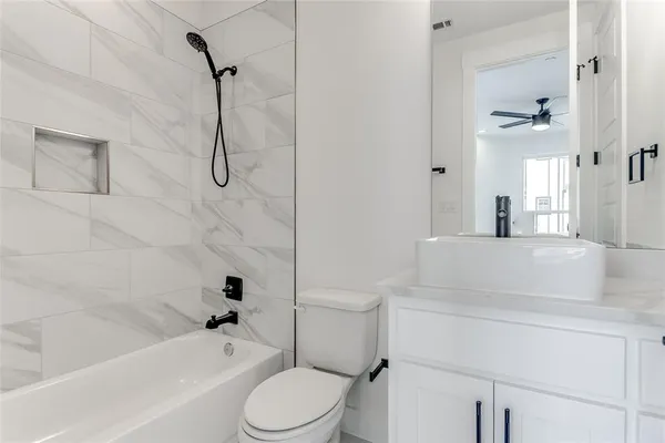 a bathroom with a sink a toilet and a bathtub