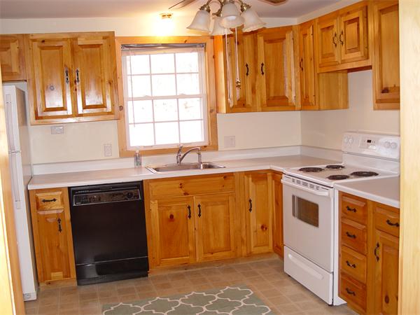 1196 Richardson Road Ashby, MA 01431 - Photo 15 of 29 a kitchen with stainless steel appliances granite countertop a stove and a sink