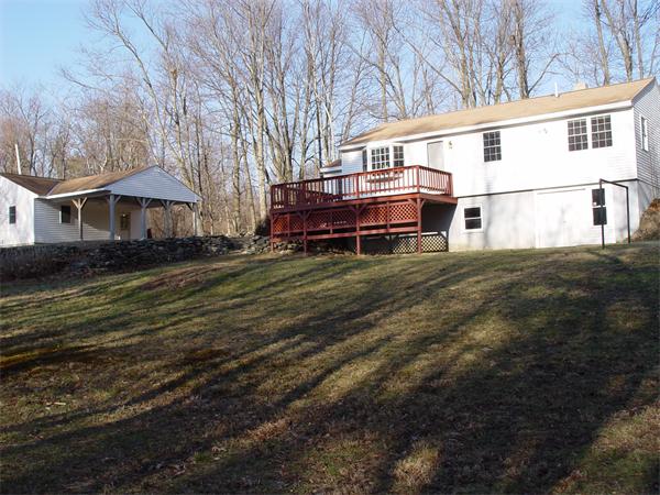 1196 Richardson Road Ashby, MA 01431 - Photo 16 of 29 a view of a house with a big yard and large trees