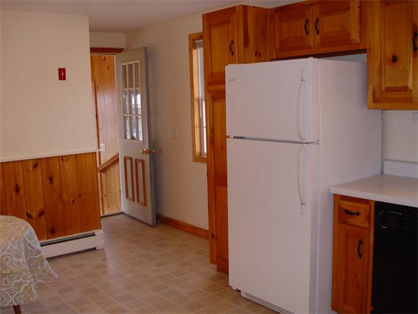 1196 Richardson Road Ashby, MA 01431 - Photo 17 of 29 a white refrigerator freezer sitting in a kitchen