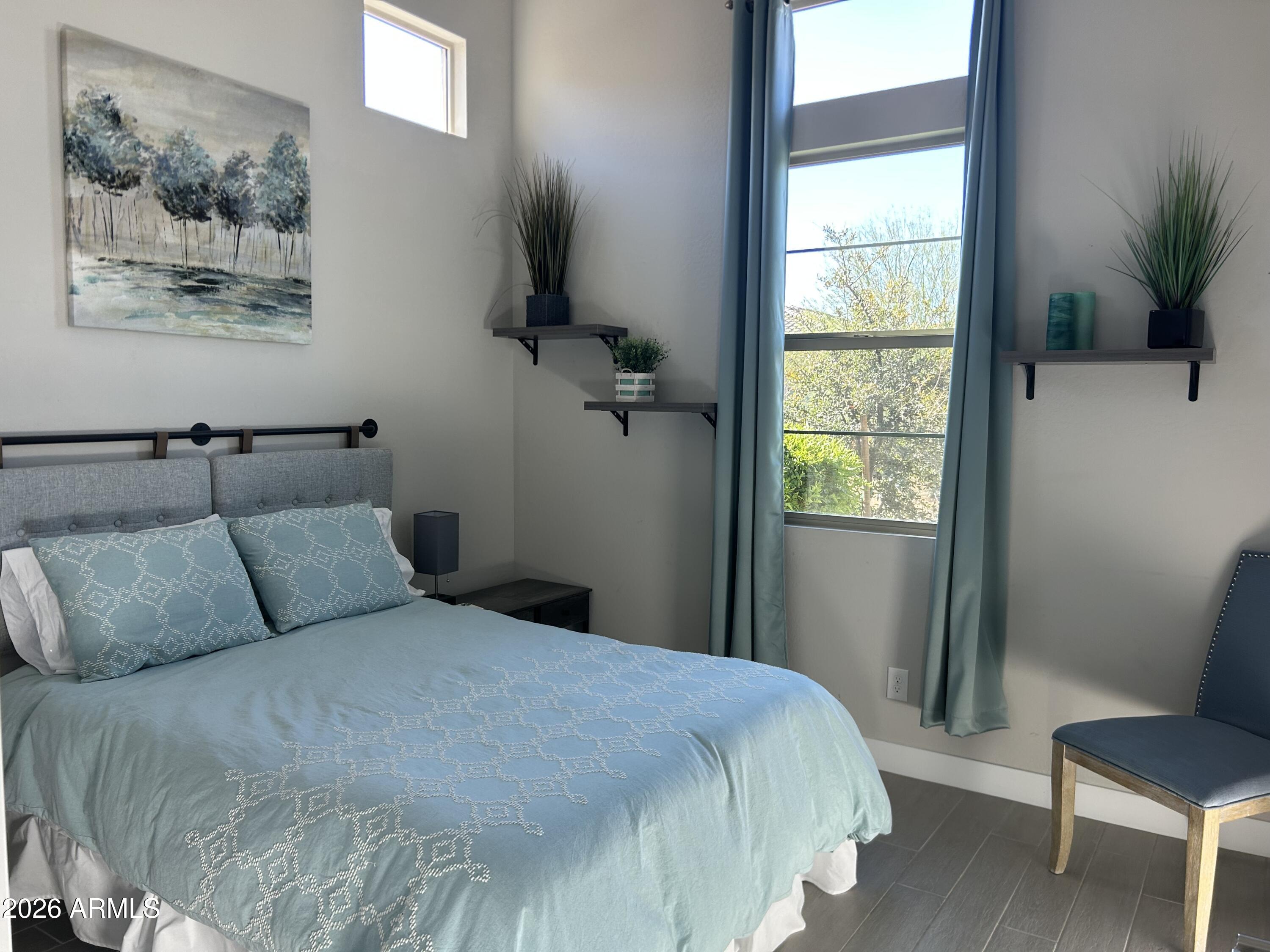 18828 East Blue Sky Drive Rio Verde, AZ 85263 - Photo 12 of 13 a bedroom with a bed and a window