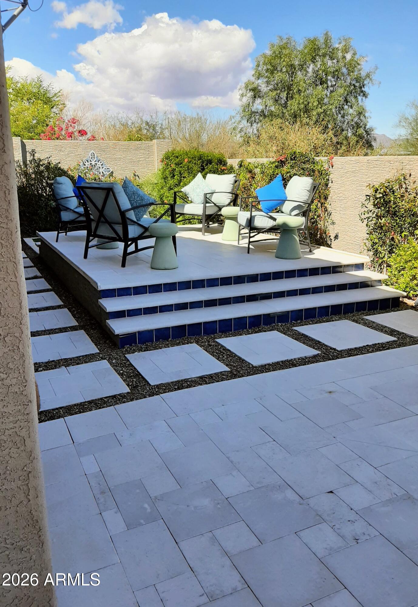18828 East Blue Sky Drive Rio Verde, AZ 85263 - Photo 3 of 13 a view of a terrace with wooden benches