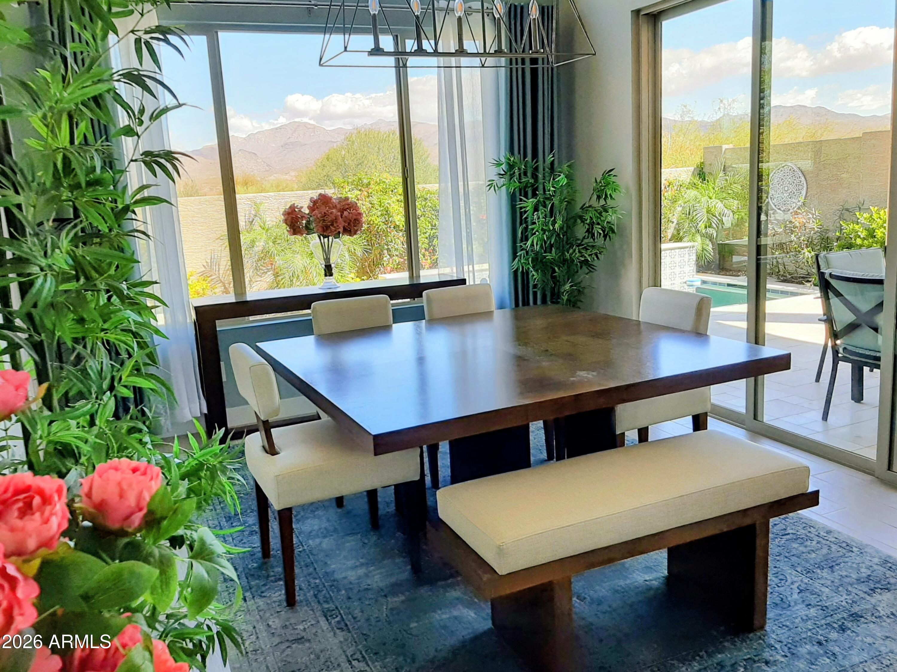 18828 East Blue Sky Drive Rio Verde, AZ 85263 - Photo 8 of 13 a view of a dining room with furniture window and wooden floor