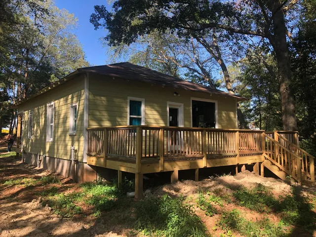 a view of backyard with a deck
