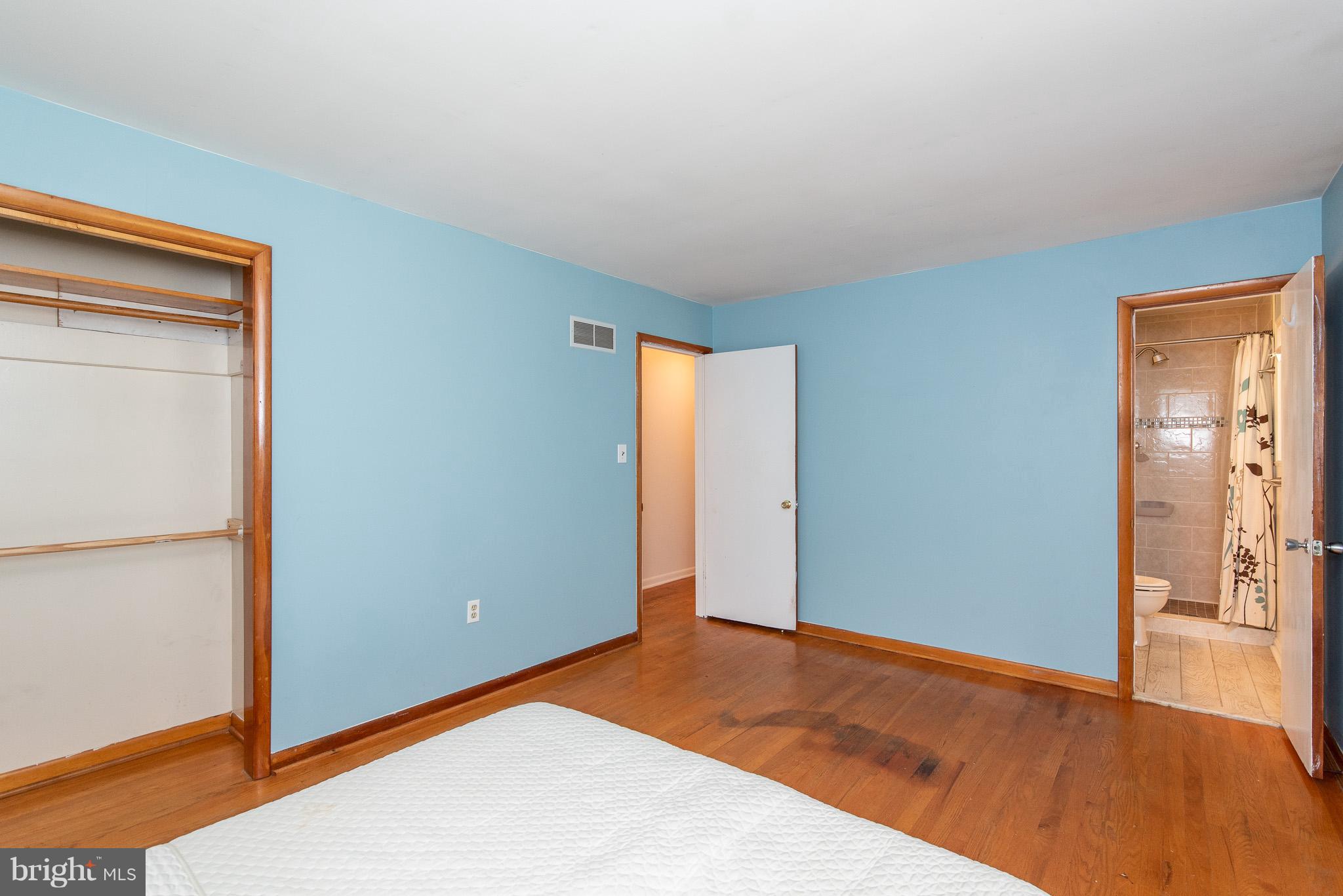 615 Eliot Road Pasadena, MD 21122 - Photo 19 of 43 a view of an empty room with wooden floor