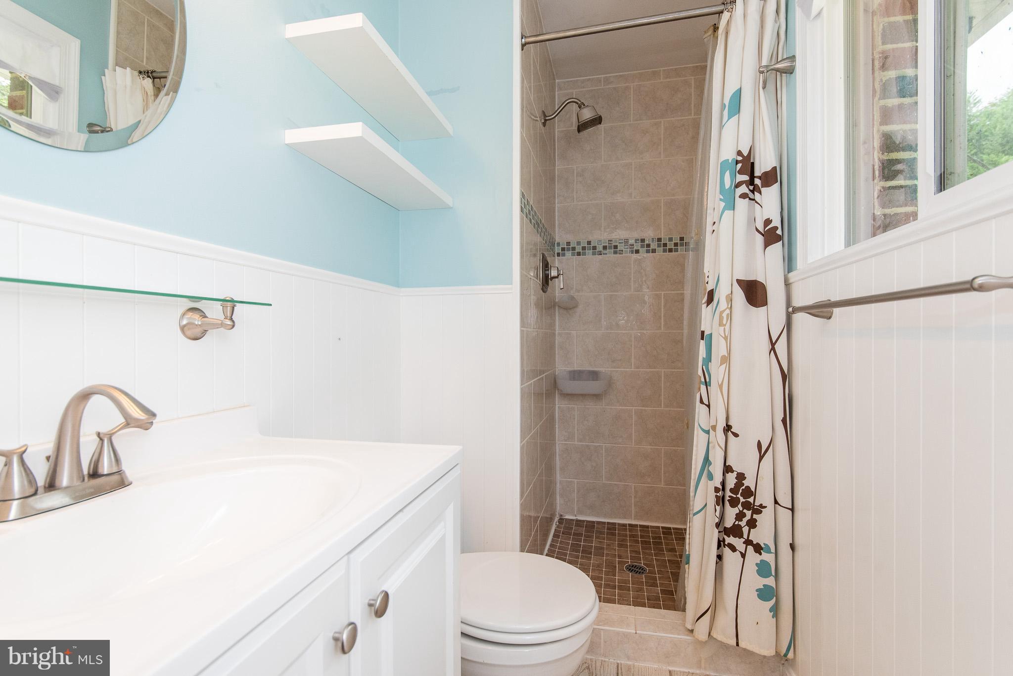 615 Eliot Road Pasadena, MD 21122 - Photo 20 of 43 a bathroom with a sink toilet and shower