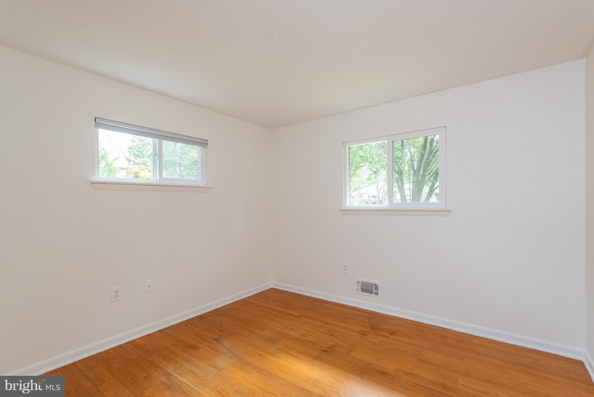 615 Eliot Road Pasadena, MD 21122 - Photo 22 of 43 a view of empty room with wooden floor and fan