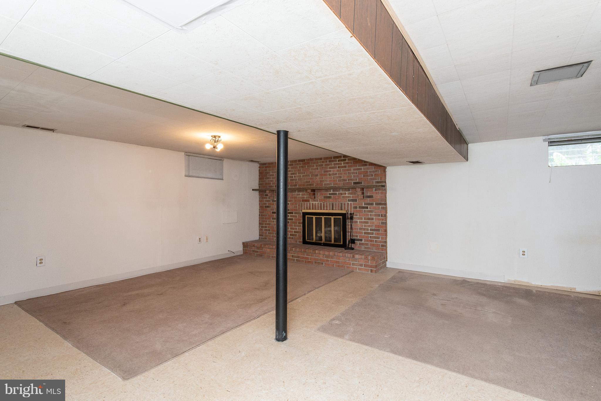 615 Eliot Road Pasadena, MD 21122 - Photo 34 of 43 a view of an empty room with a fireplace
