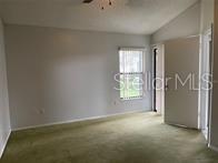 31 Lakepointe Circle Kissimmee, FL 34743 - Photo 16 of 28 an empty room with windows