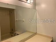 31 Lakepointe Circle Kissimmee, FL 34743 - Photo 25 of 28 a bathroom with a shower