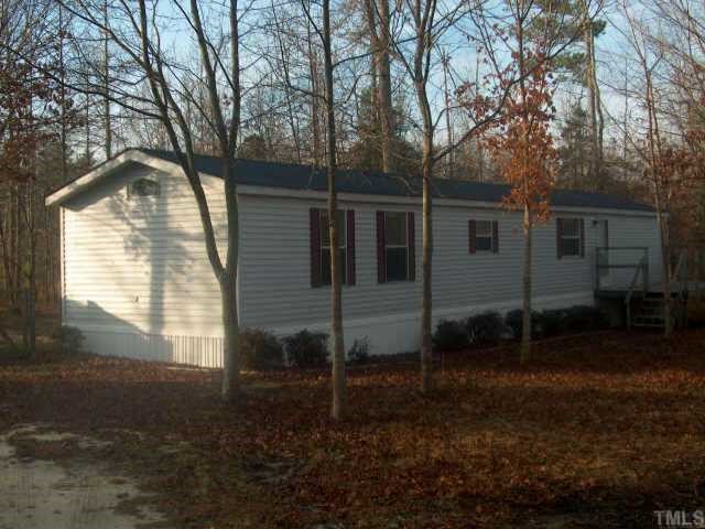1621 Ridge Road Zebulon, NC 27597 - Photo 1 of 1 a view of a house with backyard