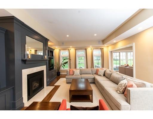 117 Forest Street Wellesley, MA 02481 - Photo 20 of 28 a living room with furniture and a fireplace