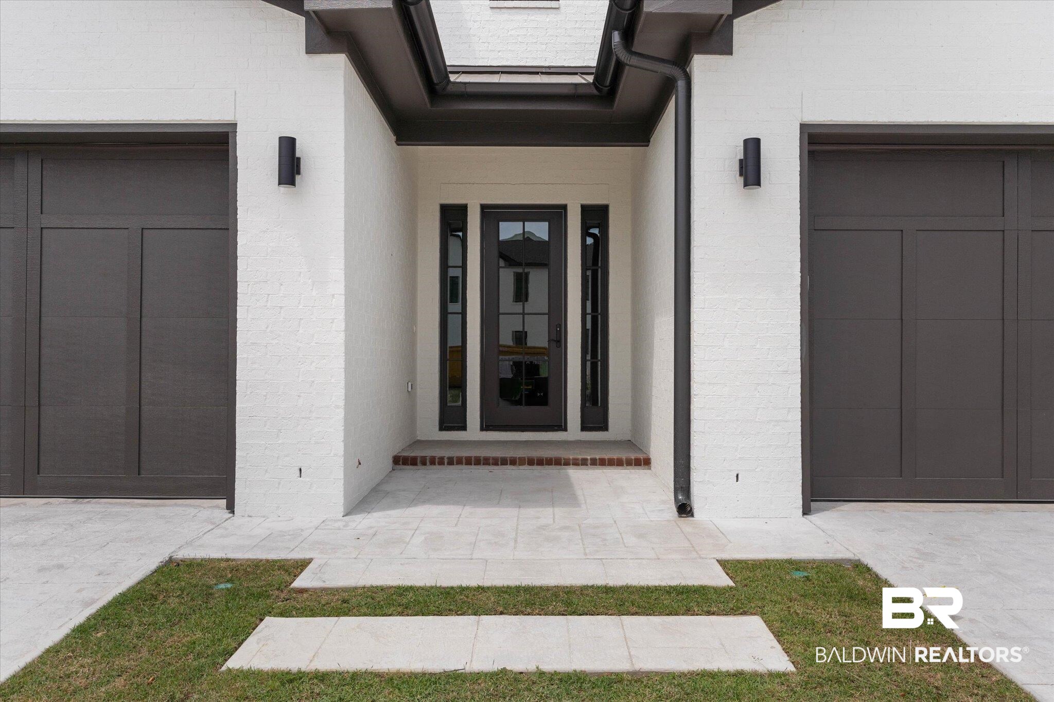 853 Inlet Circle Gulf Shores, AL 36542 - Photo 37 of 55 View of exterior entry featuring a garage