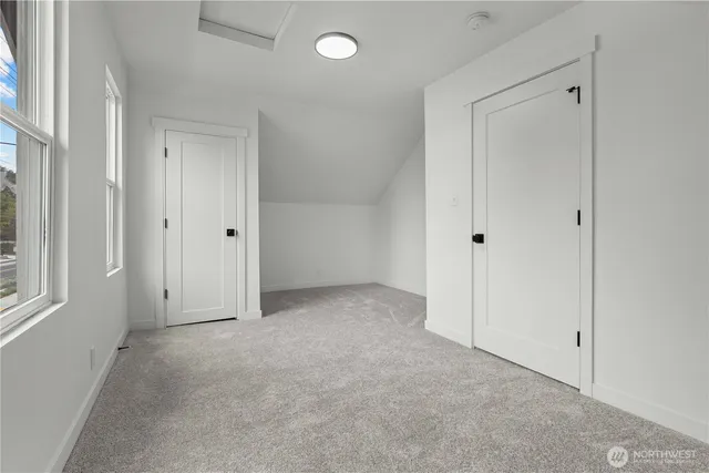 a view of an empty room and a window