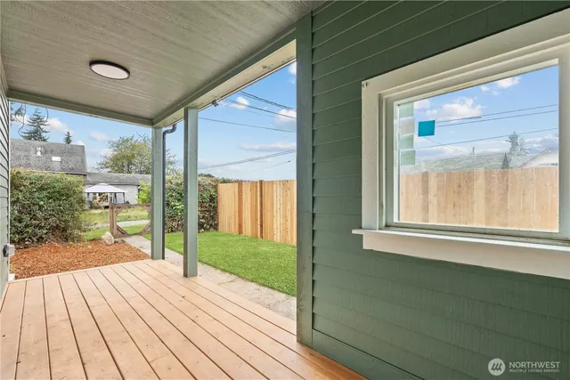 a view of a porch and wooden floor