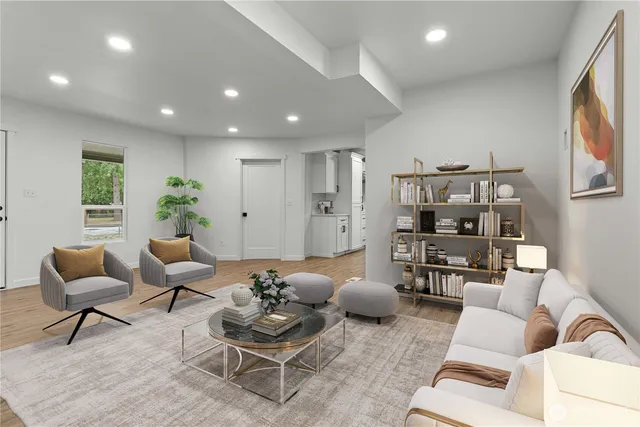 a living room with furniture and wooden floor