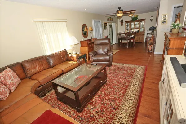 a view of a dining room with furniture and wooden floor