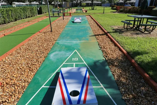 a view of a house with swimming pool and yard