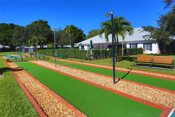 a view of swimming pool with a yard