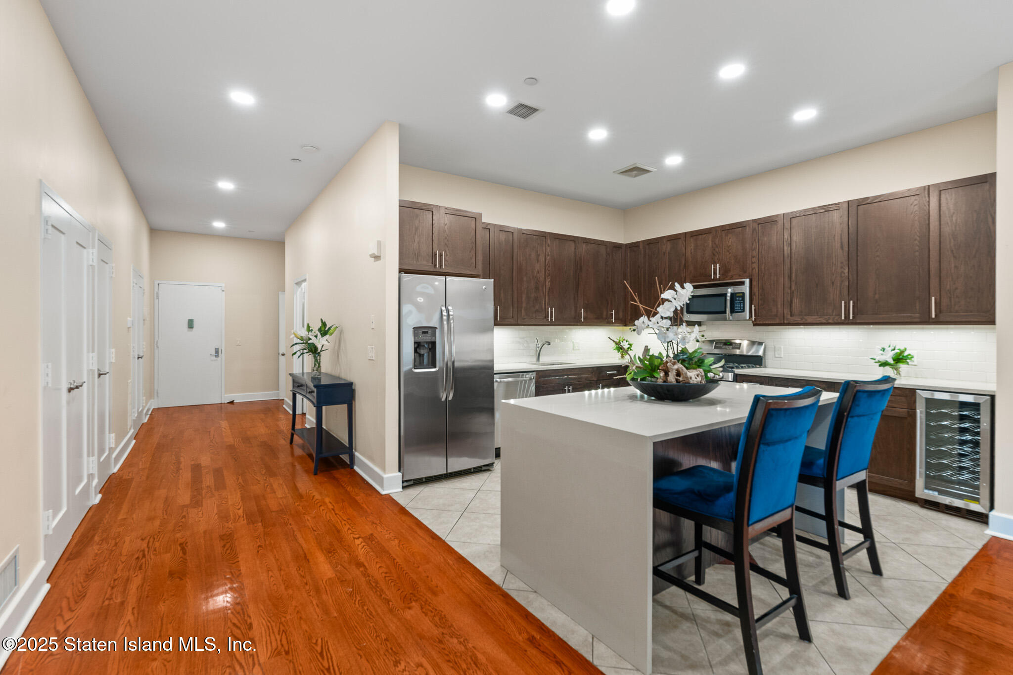 90 Bay Street Landing, Unit 1F Staten Island, NY 10301 - Photo 14 of 55 a kitchen with a table and chairs in it