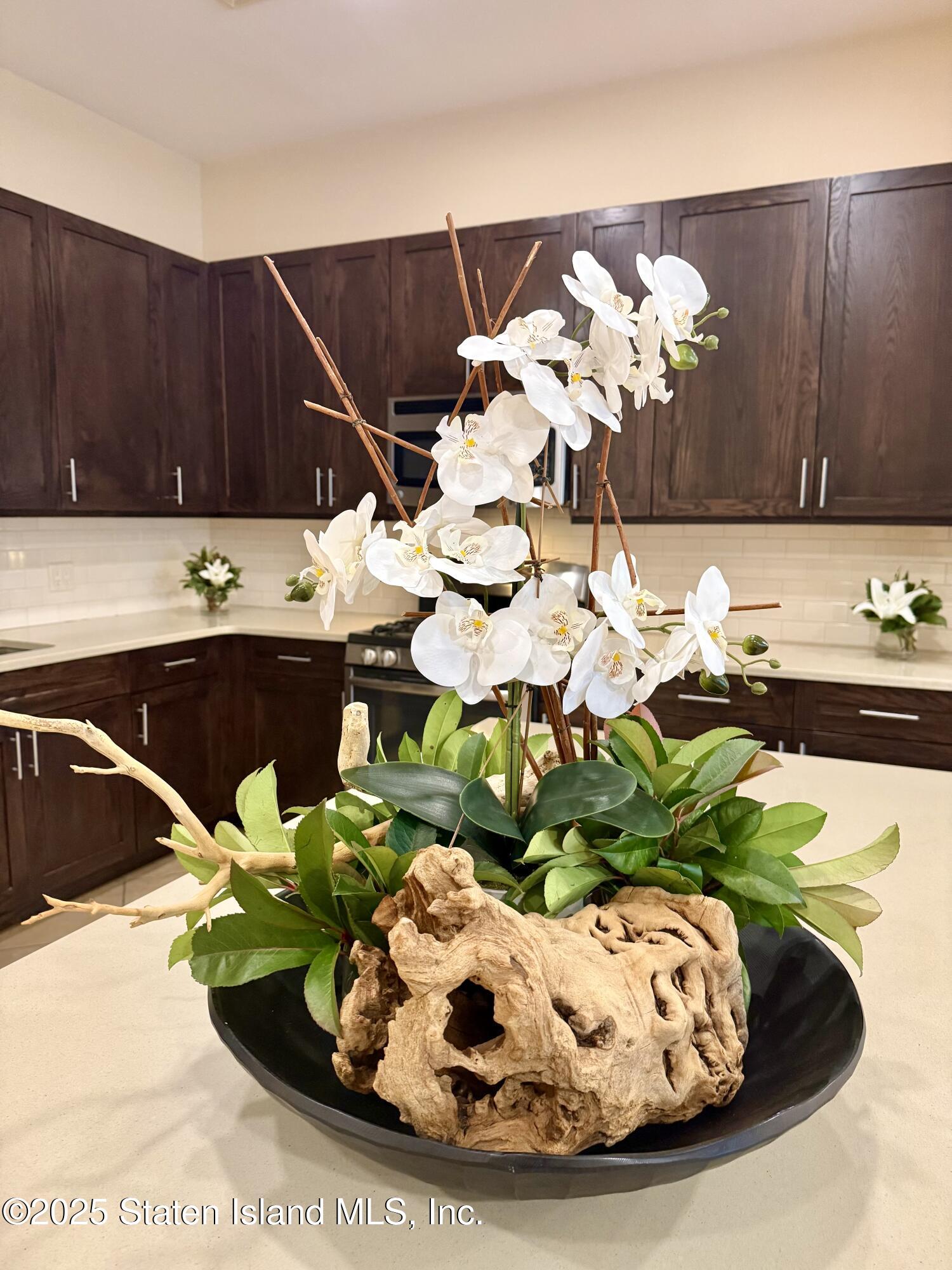 90 Bay Street Landing, Unit 1F Staten Island, NY 10301 - Photo 18 of 55 a view of a sink with a dining table and chairs