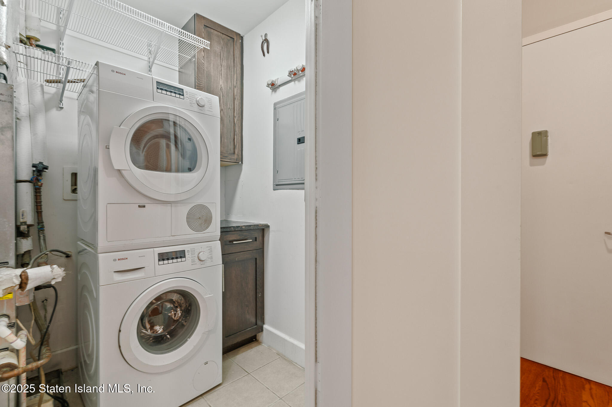 90 Bay Street Landing, Unit 1F Staten Island, NY 10301 - Photo 24 of 55 a utility room with dryer and washer