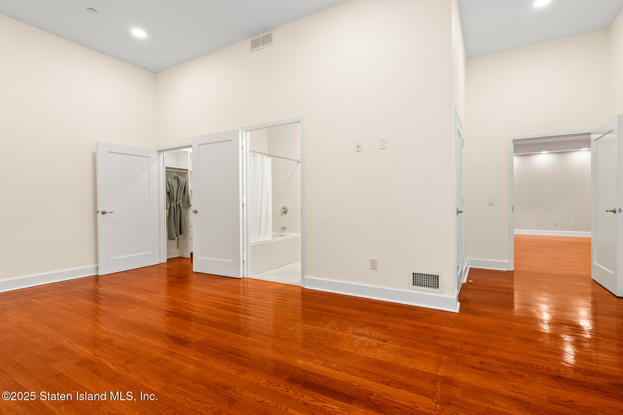 90 Bay Street Landing, Unit 1F Staten Island, NY 10301 - Photo 26 of 55 a view of an empty room with wooden floor
