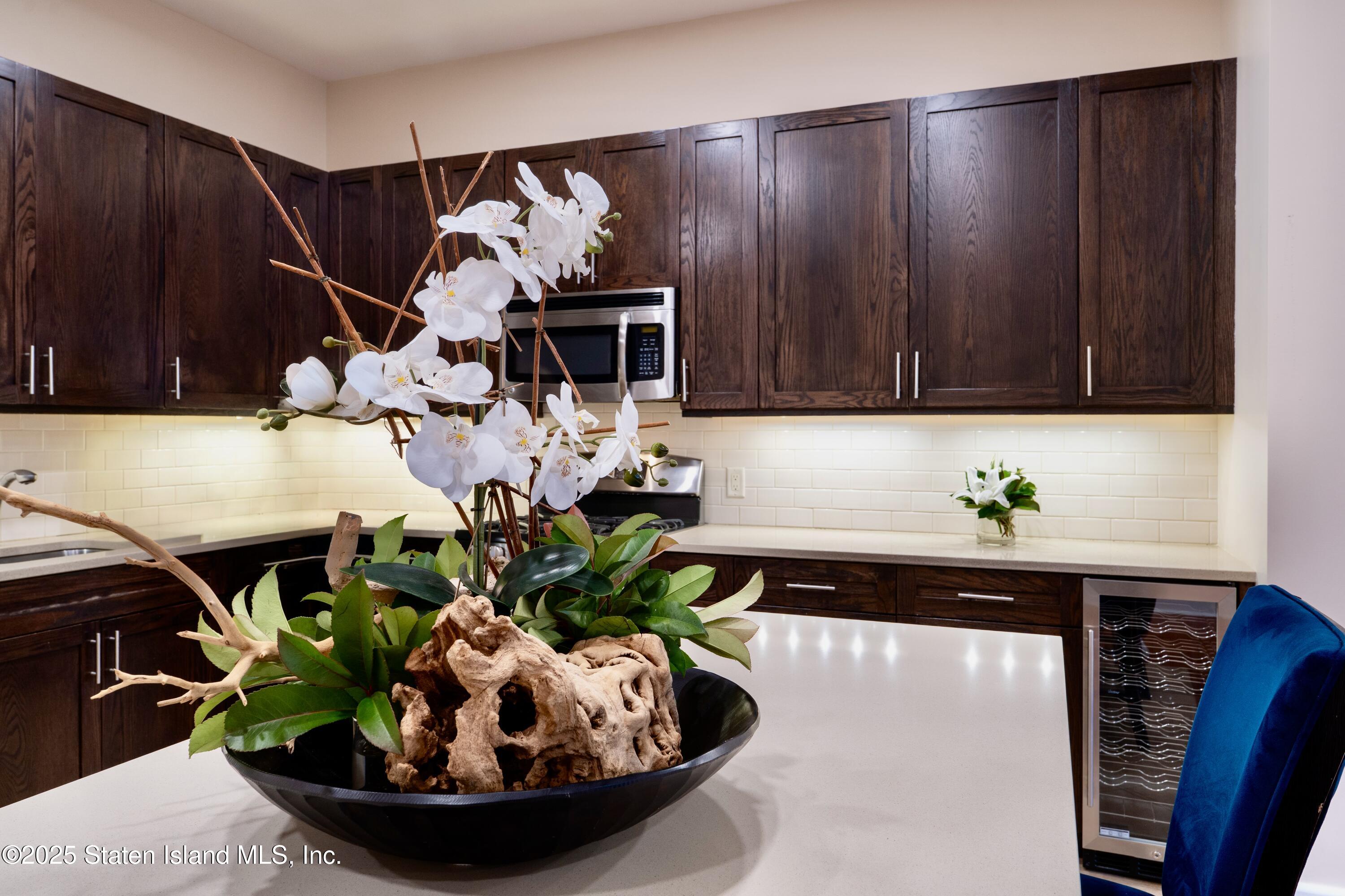 90 Bay Street Landing, Unit 1F Staten Island, NY 10301 - Photo 3 of 55 a view of a living room with furniture and a potted plant