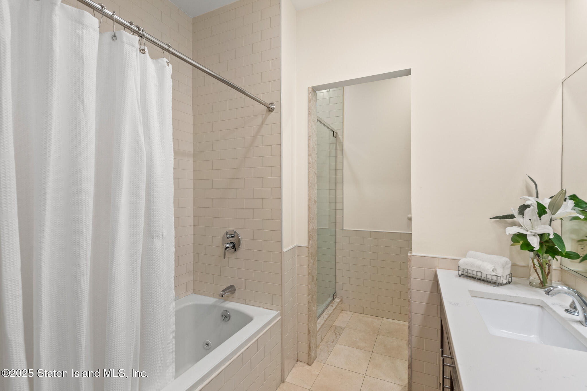 90 Bay Street Landing, Unit 1F Staten Island, NY 10301 - Photo 36 of 55 a bathroom with a tub and shower