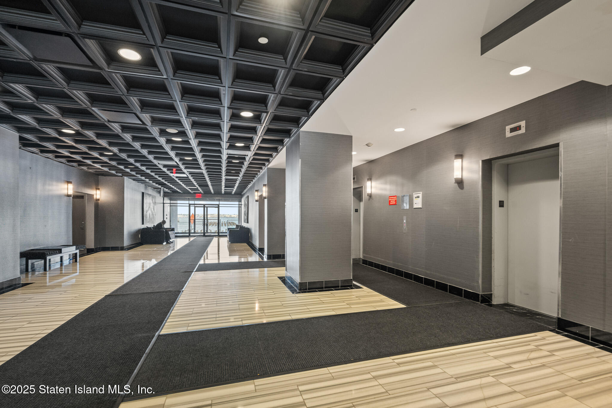 90 Bay Street Landing, Unit 1F Staten Island, NY 10301 - Photo 41 of 55 a view of a hall with wooden floor