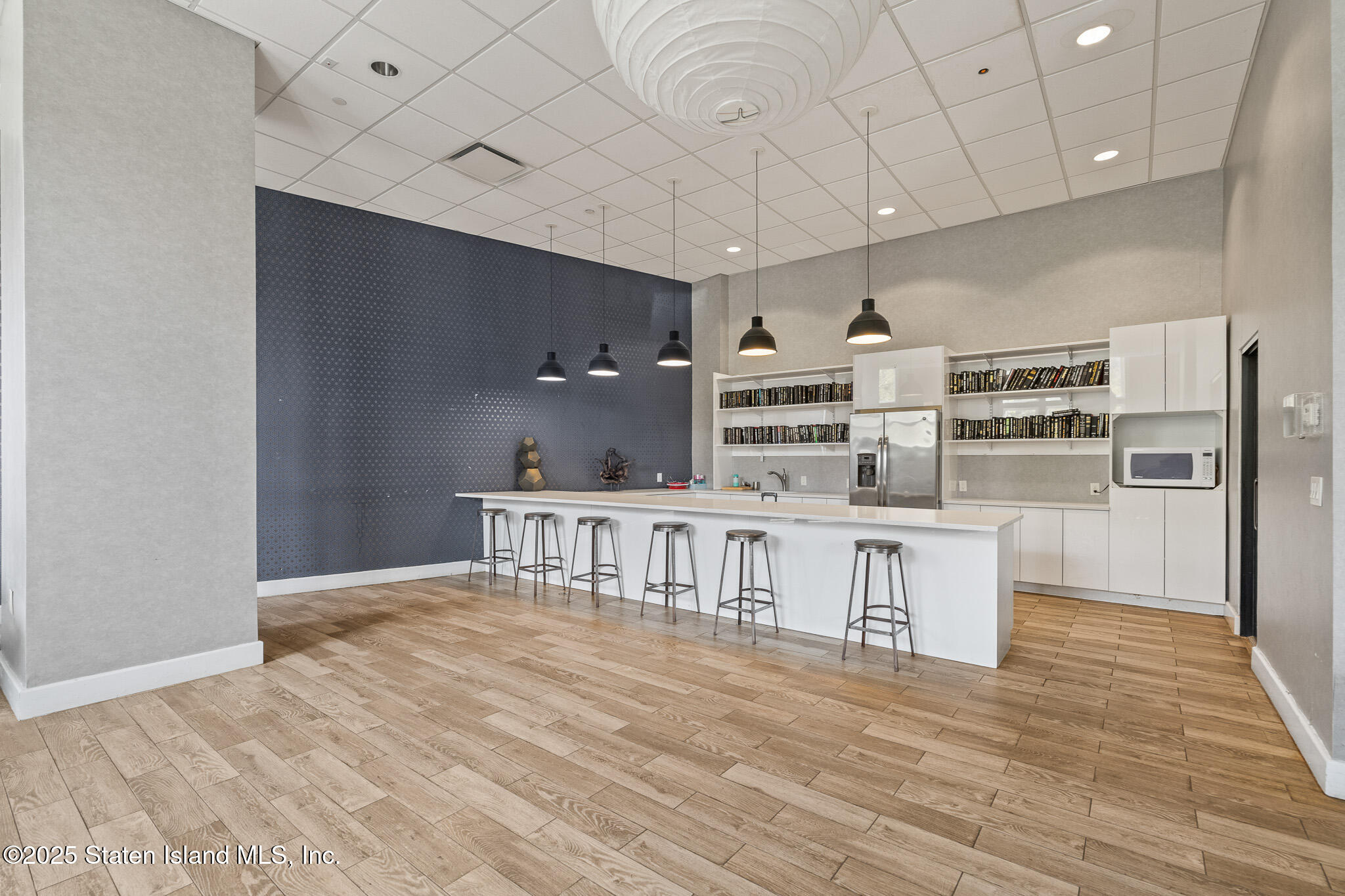 90 Bay Street Landing, Unit 1F Staten Island, NY 10301 - Photo 48 of 55 a view of kitchen with furniture and wooden floor