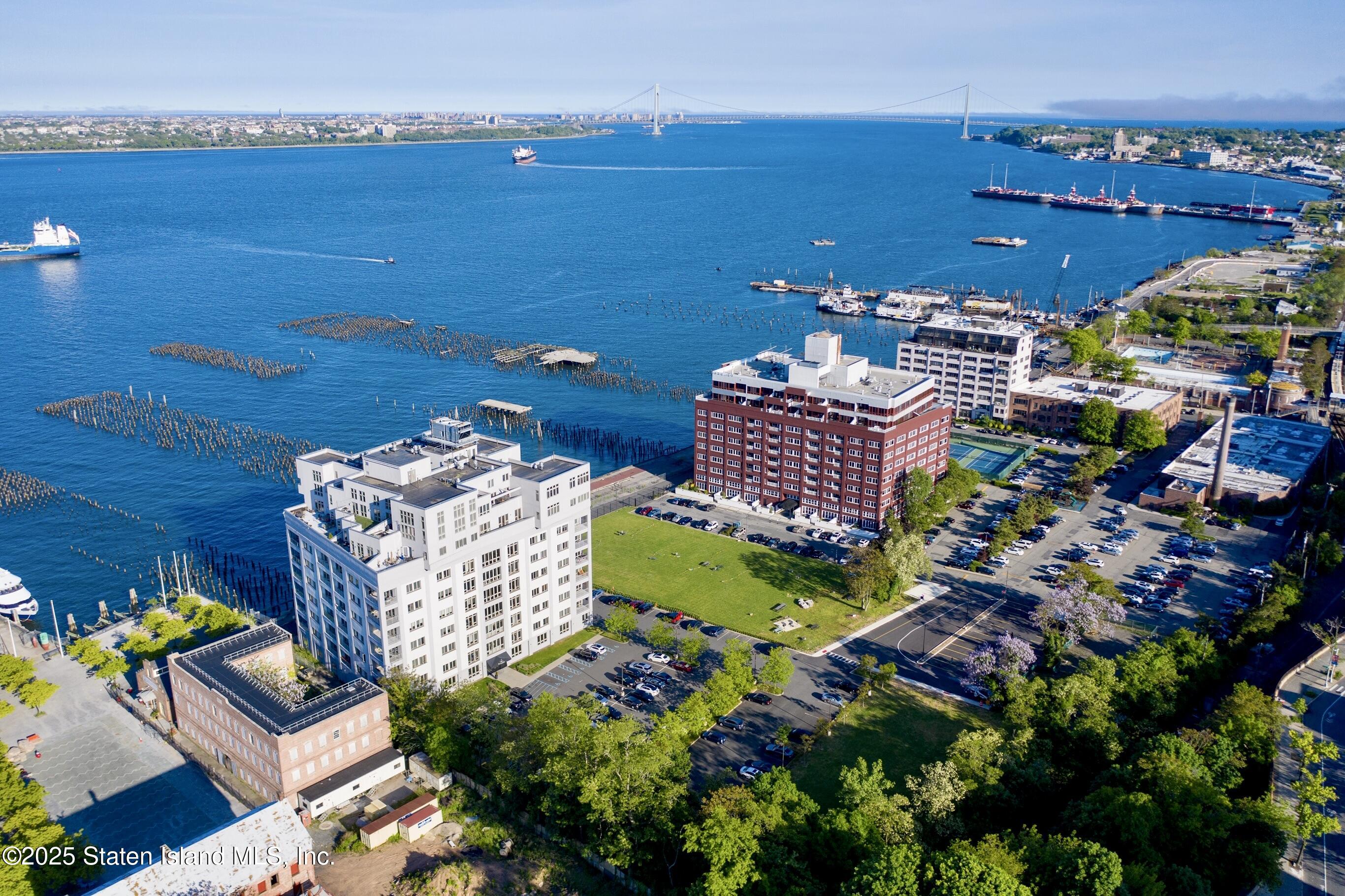 90 Bay Street Landing, Unit 1F Staten Island, NY 10301 - Photo 51 of 55 a view of a chairs and table on the terrace
