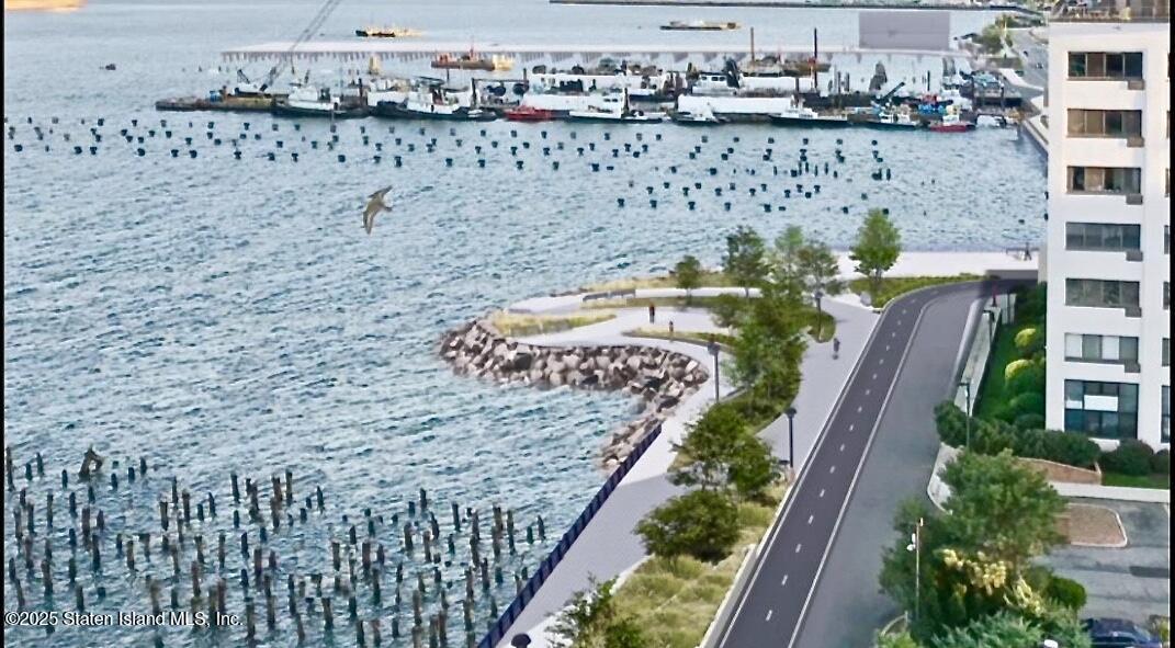 90 Bay Street Landing, Unit 1F Staten Island, NY 10301 - Photo 54 of 55 a view of a balcony with an outdoor space