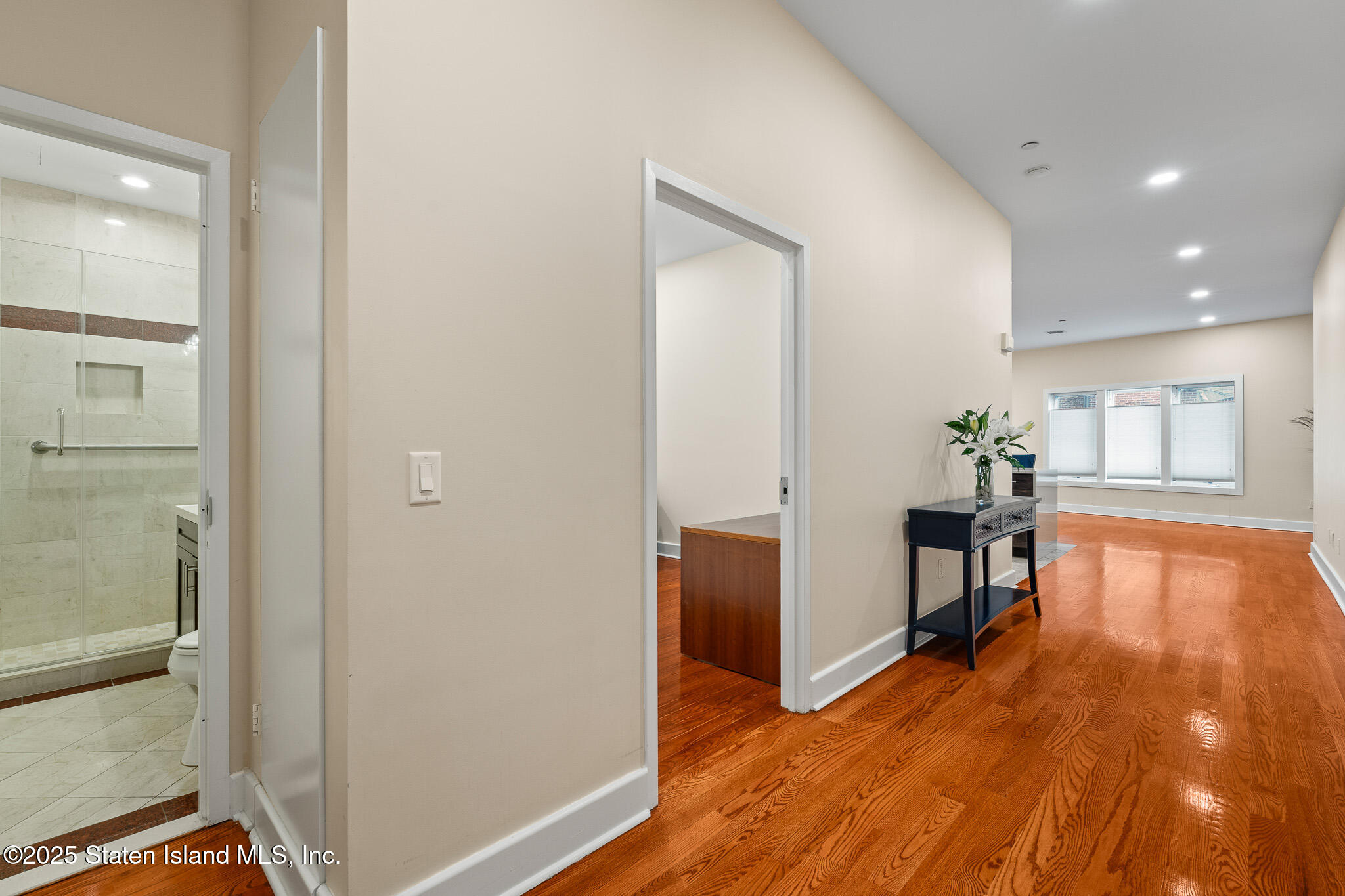 90 Bay Street Landing, Unit 1F Staten Island, NY 10301 - Photo 6 of 55 a view of a livingroom with furniture and hardwood floor