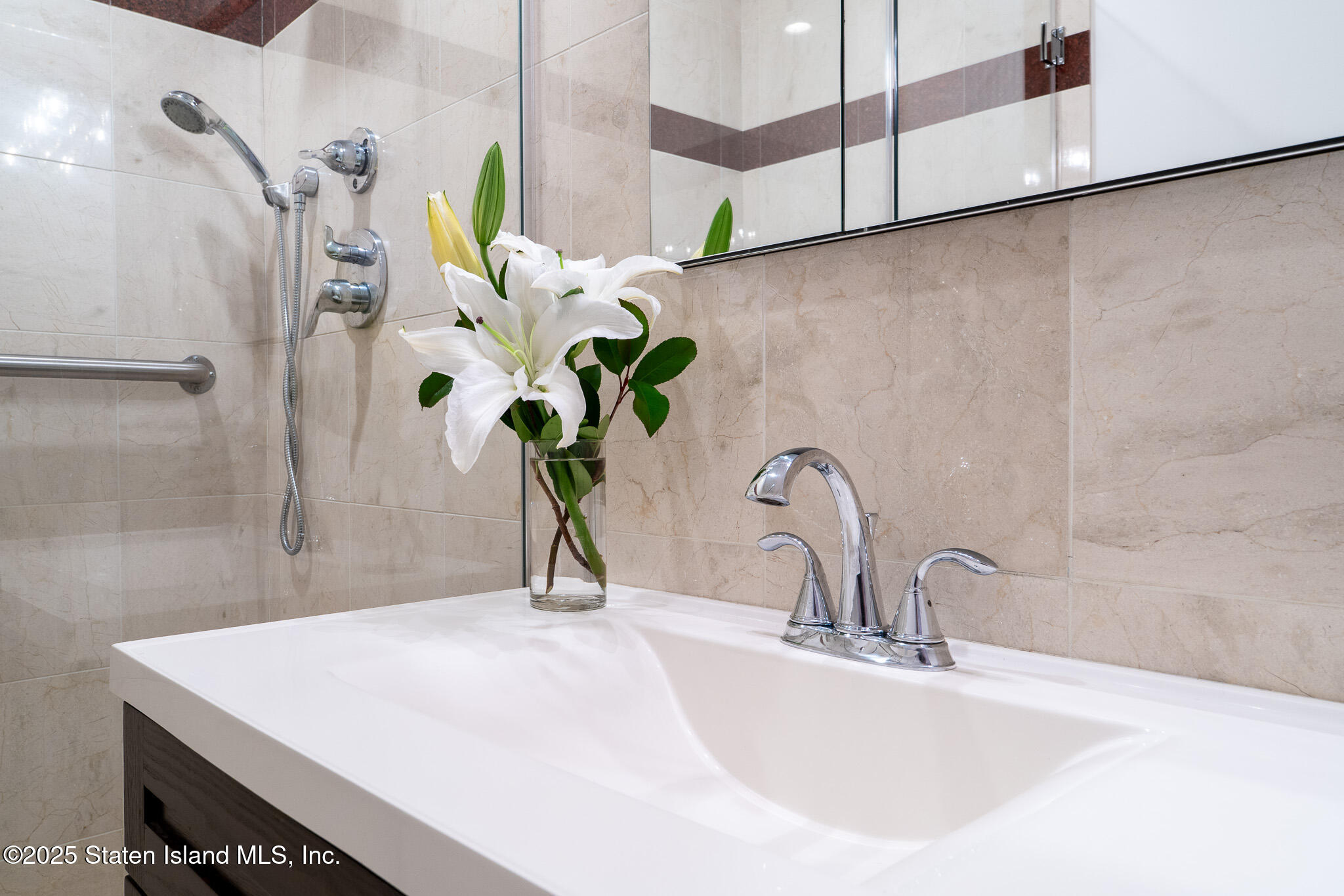 90 Bay Street Landing, Unit 1F Staten Island, NY 10301 - Photo 8 of 55 a bathroom with a sink a vanity and a potted plant
