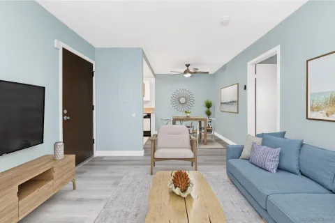 a living room with furniture and a flat screen tv