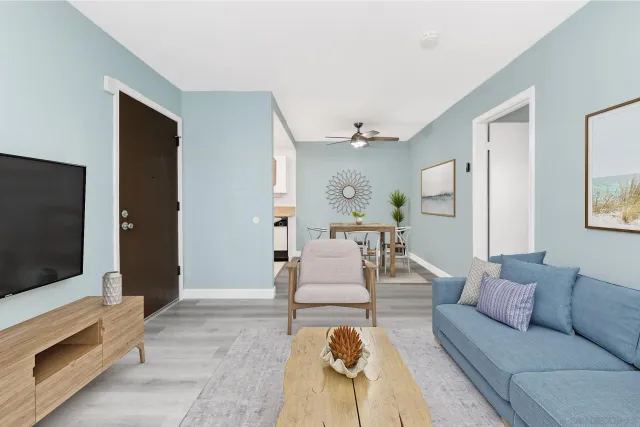 a living room with furniture and a flat screen tv