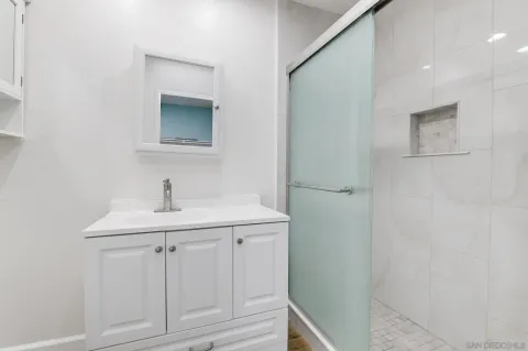 a bathroom with a sink and mirror