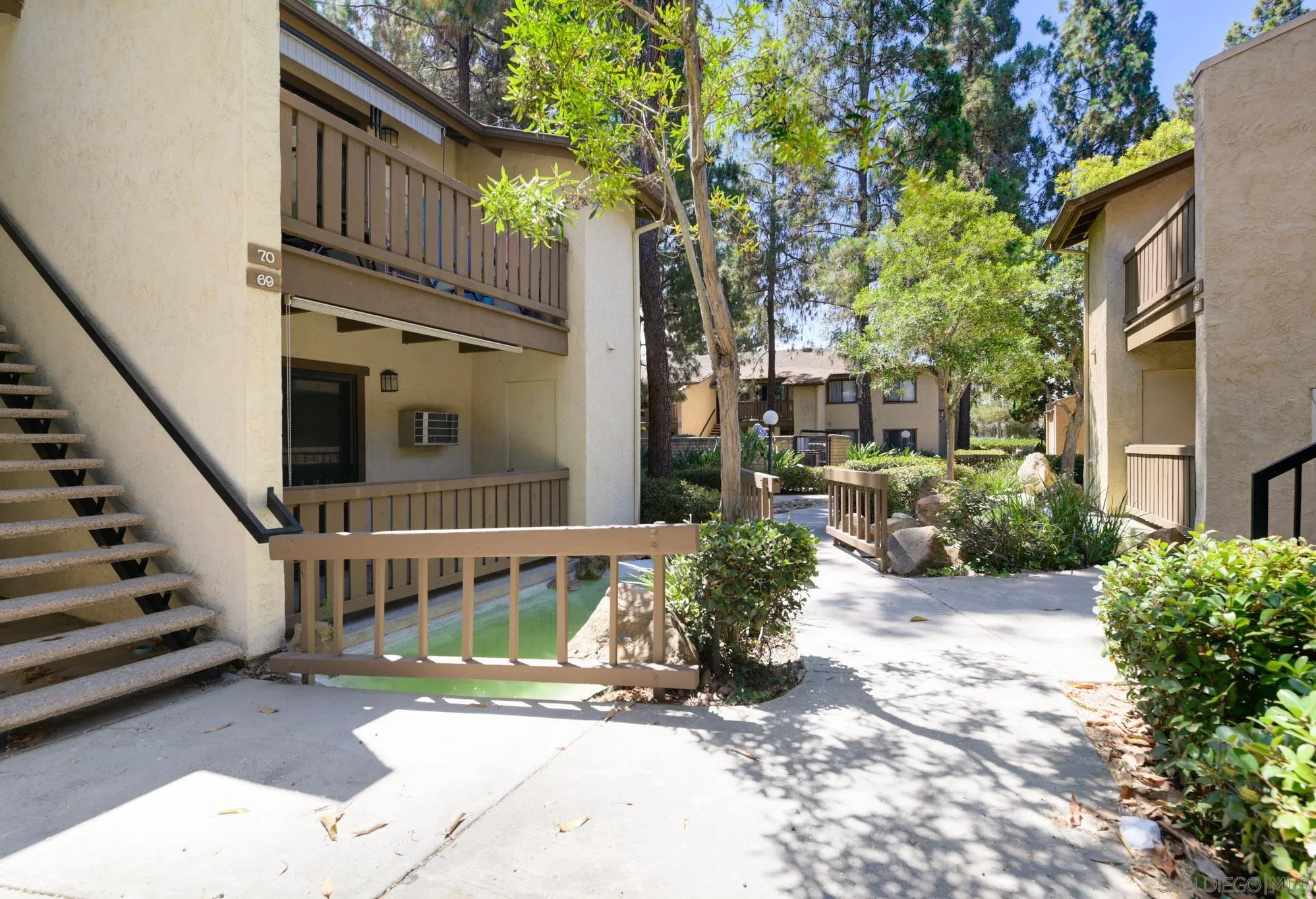 10222 Black Mountain Road, Unit 69 San Diego, CA 92126 - Photo 18 of 23 a view of a house with a yard