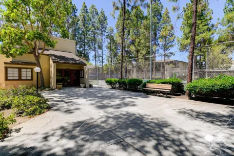 a view of a house with a yard and tree s